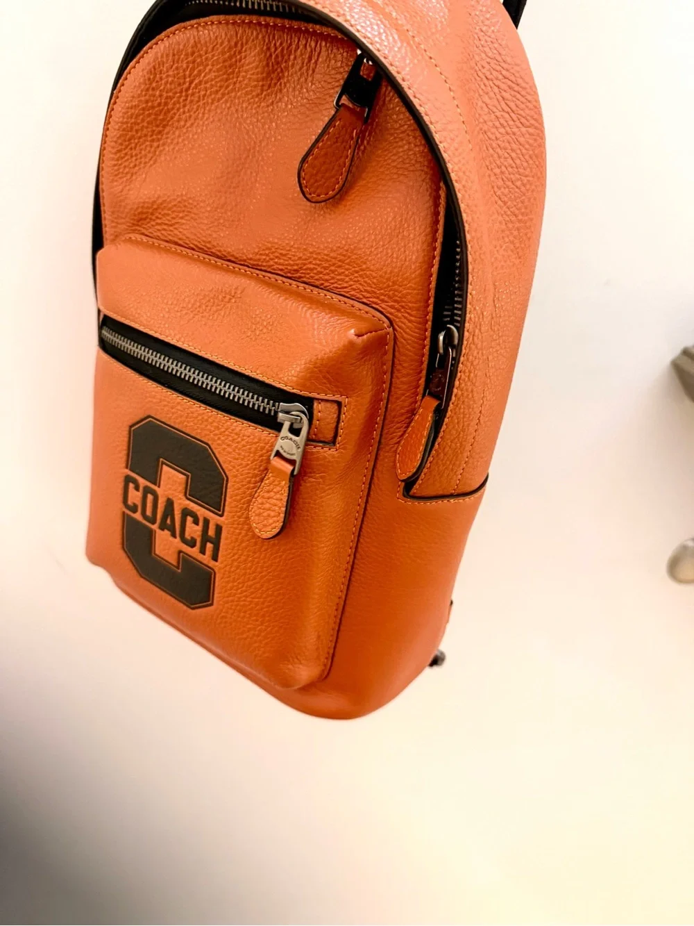Coach Orange Leather Sling Bag with Black Logo